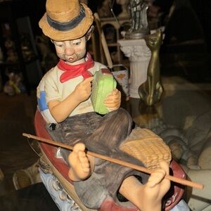 Antique Ceramic Figurine with Red and Green Accents